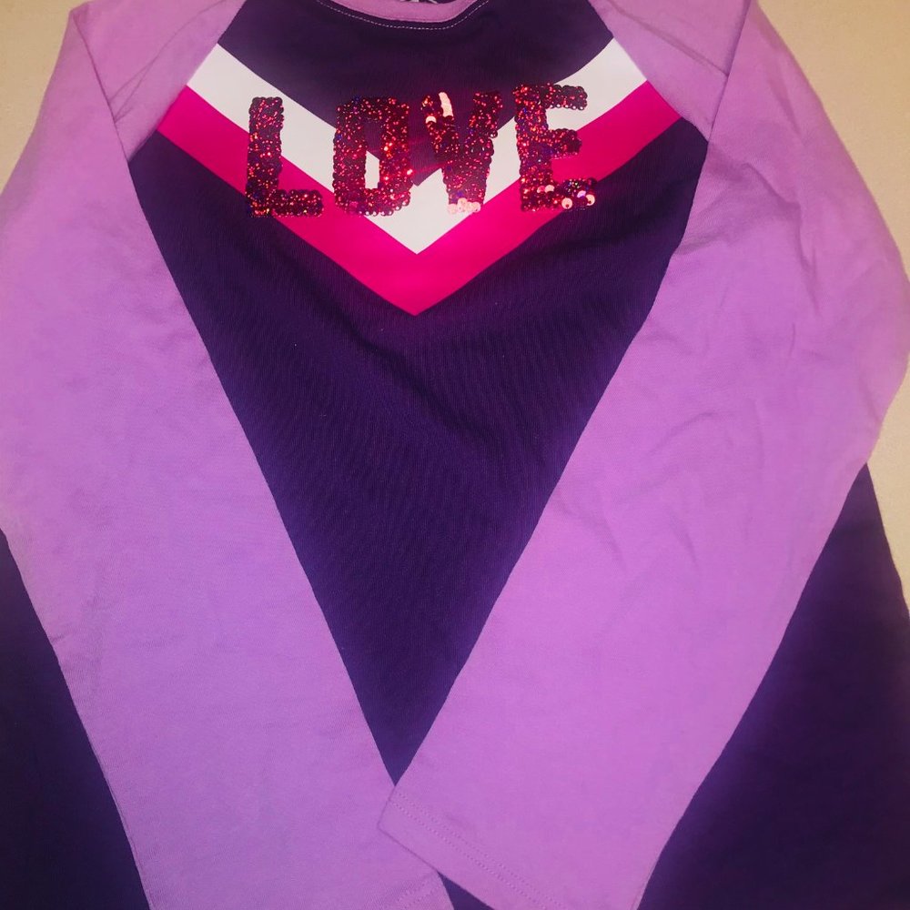 This is a flip sequence girls long sleeve tee